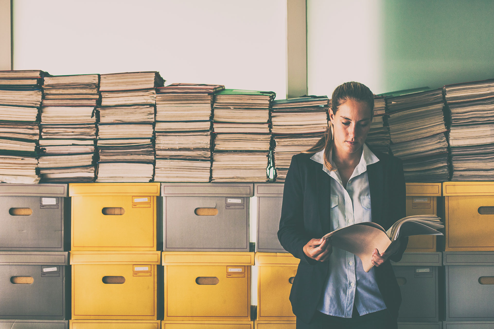 Female law clerk reviewing a court file.