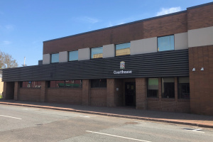 Brick professional centre with a courthouse sign over the front entrance. 