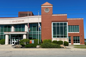 Brick and glass building under a blue sky. 